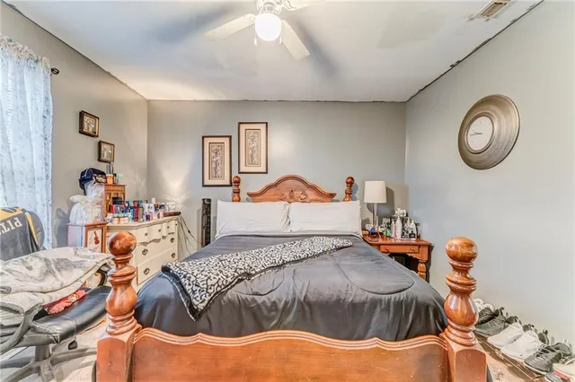 a bedroom with a bed and window