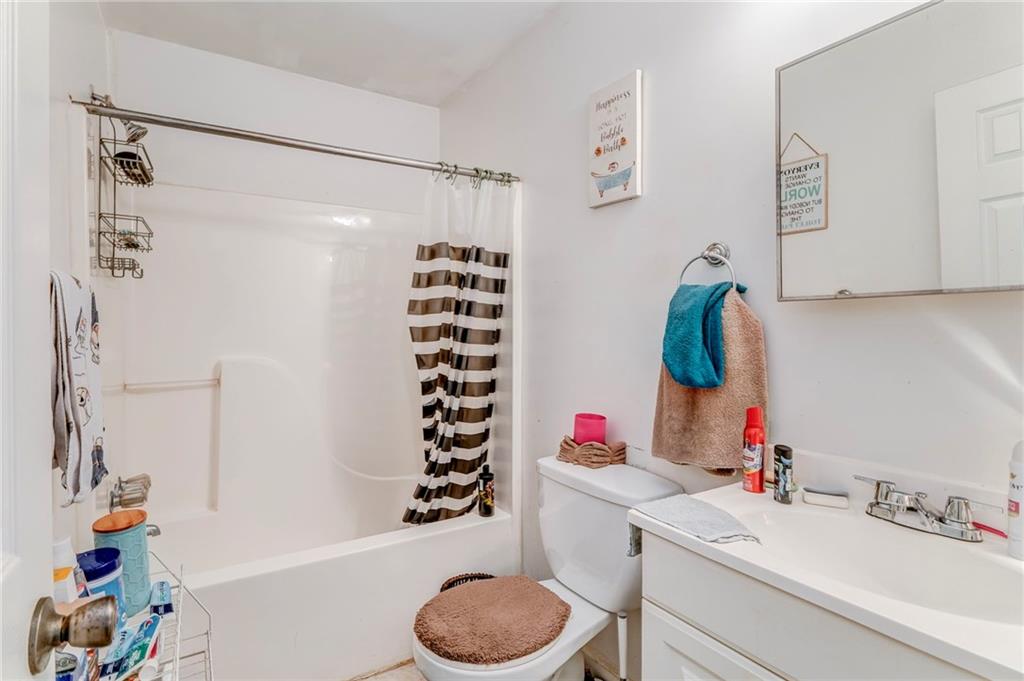 213 Iron Street Northwest Rome, GA 30165 - Photo 24 of 28 a bathroom with a sink toilet and shower
