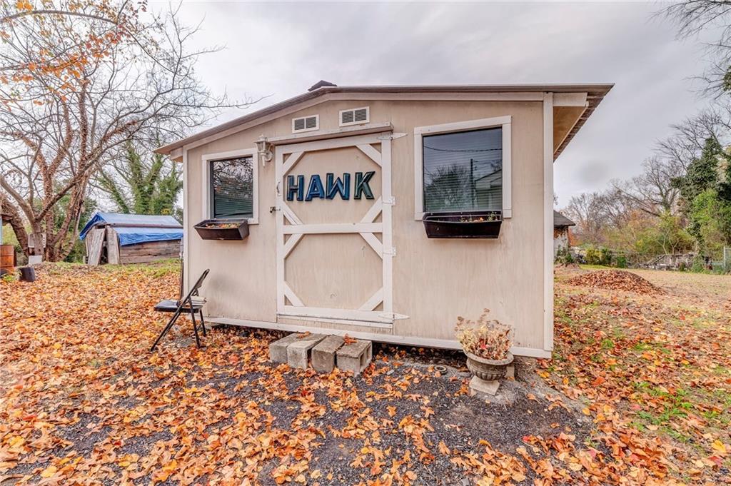 213 Iron Street Northwest Rome, GA 30165 - Photo 27 of 28 a front view of a house with a yard