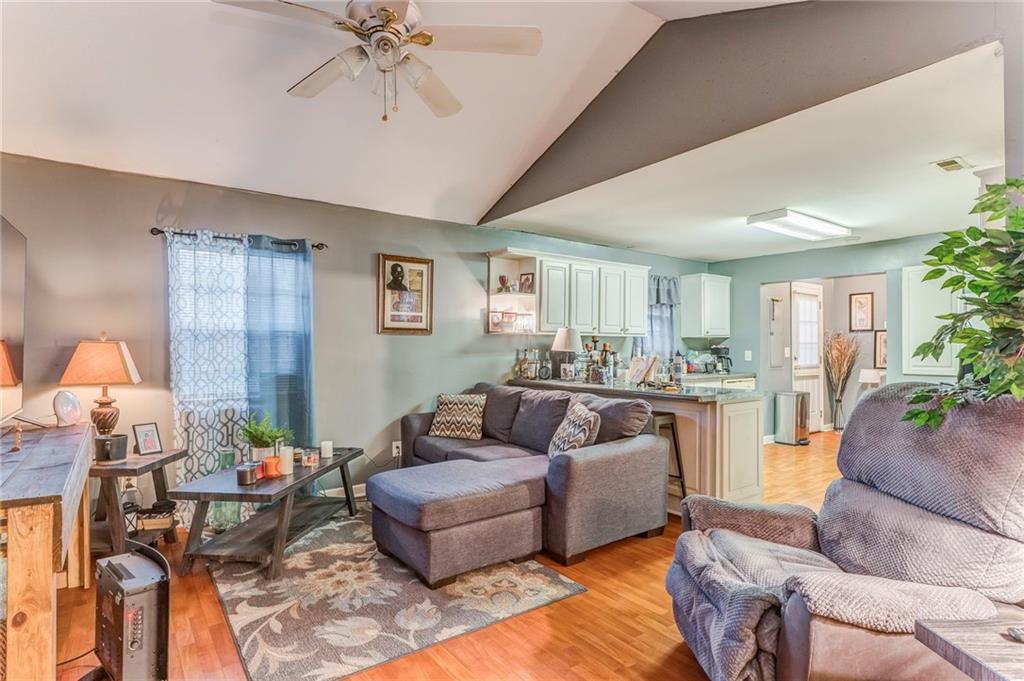 213 Iron Street Northwest Rome, GA 30165 - Photo 9 of 28 a living room with furniture and a chandelier