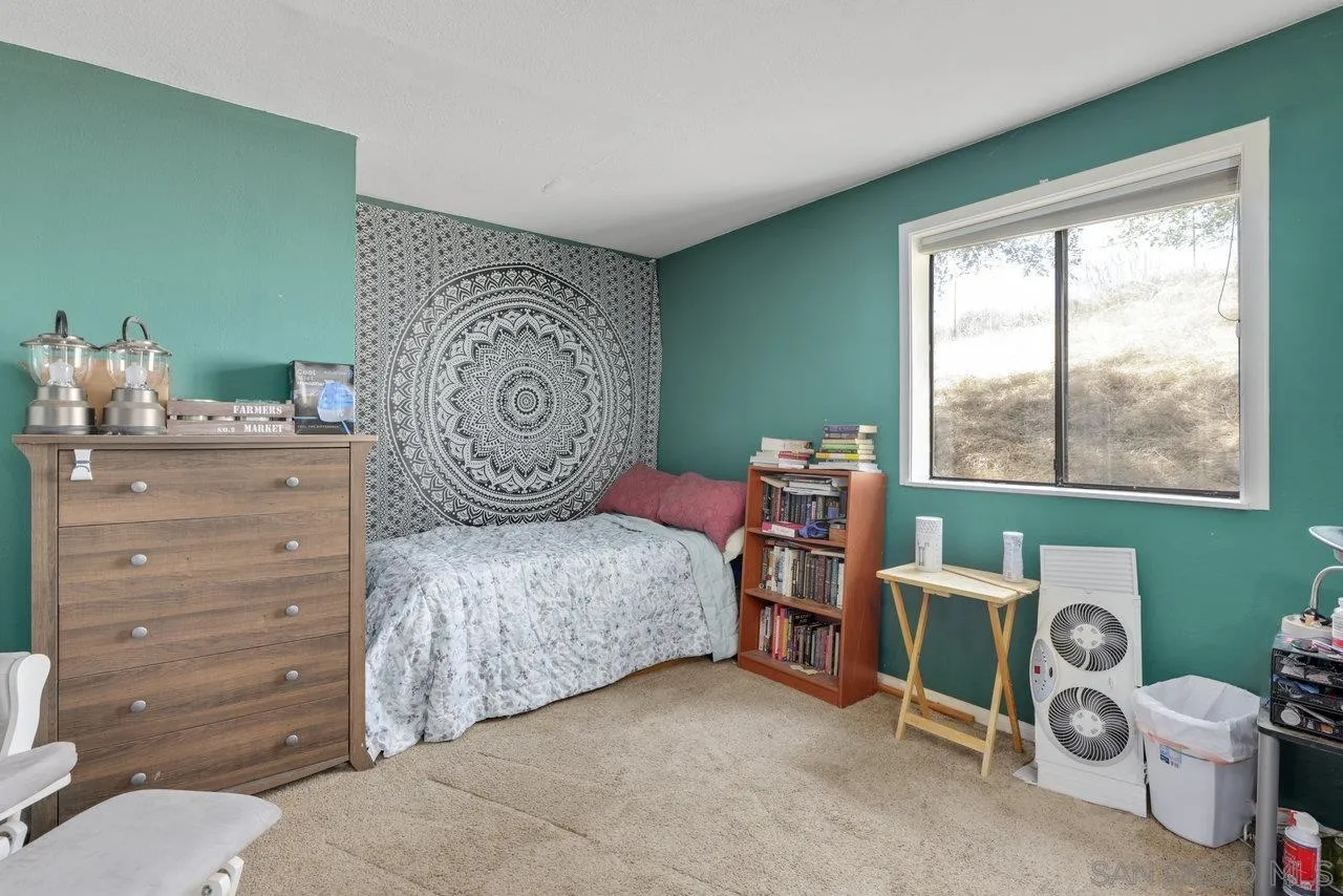 2212 Sonora Way Ramona, CA 92065 - Photo 14 of 29 a bedroom with a bed and a window