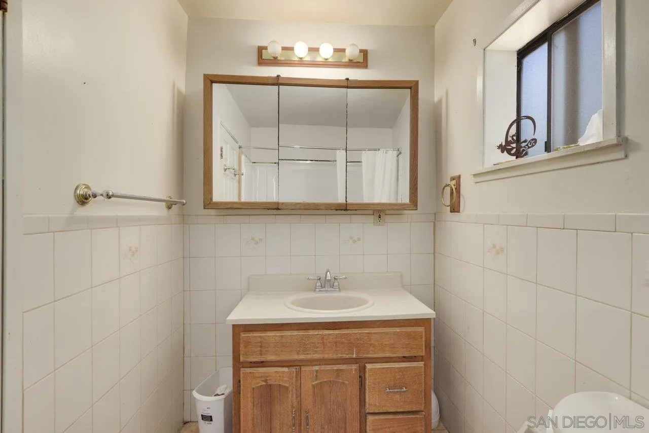 2212 Sonora Way Ramona, CA 92065 - Photo 16 of 29 a bathroom with a sink a vanity and a mirror