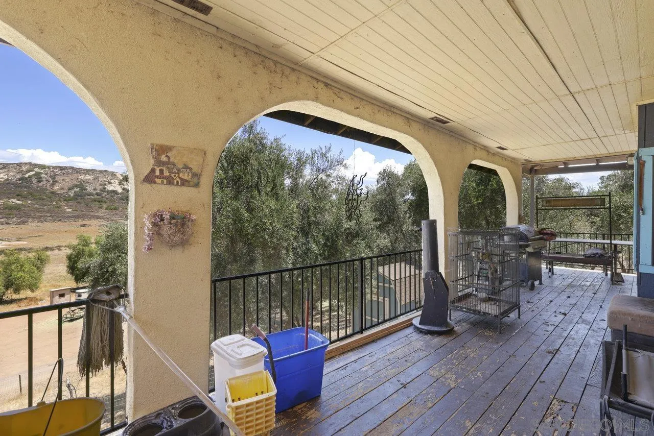 2212 Sonora Way Ramona, CA 92065 - Photo 17 of 29 a balcony with wooden floor table and chairs