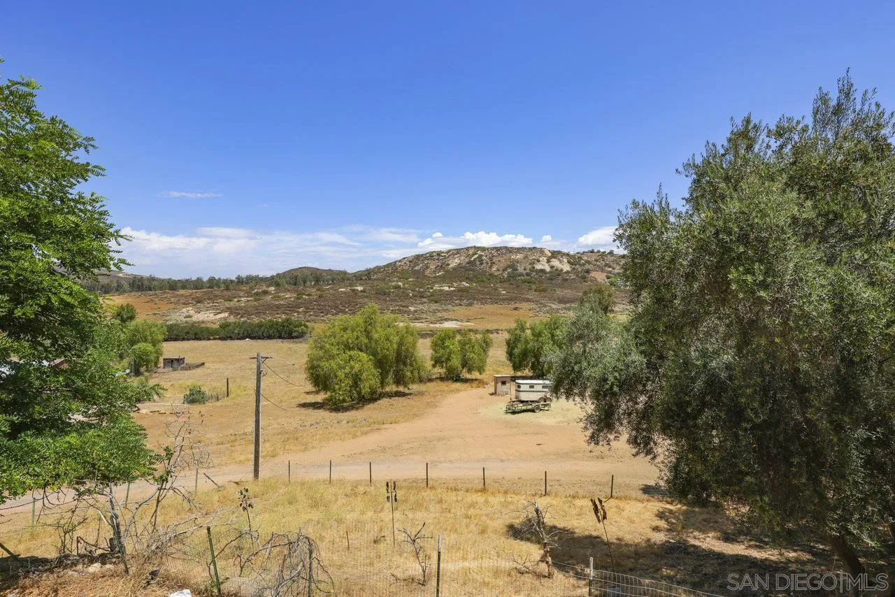 2212 Sonora Way Ramona, CA 92065 - Photo 20 of 29 a view of a lake with a mountain in the background