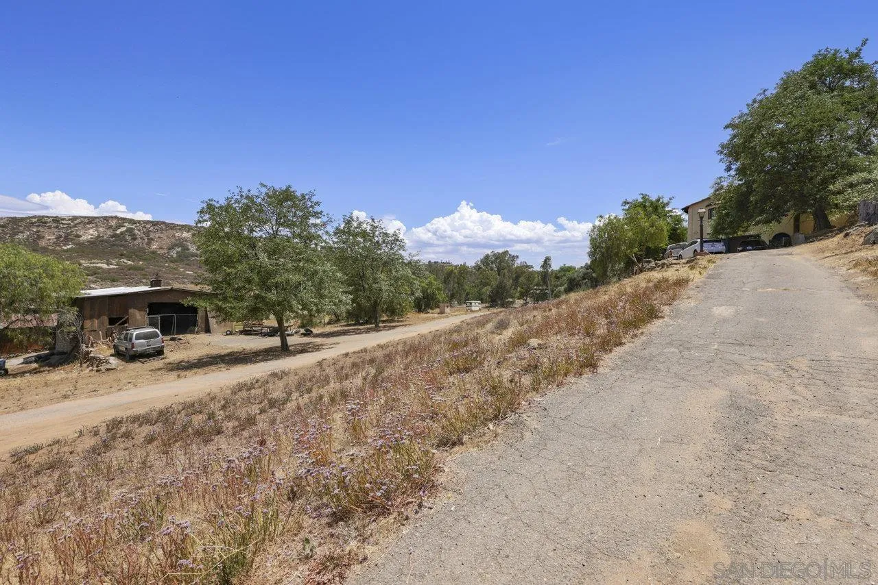 2212 Sonora Way Ramona, CA 92065 - Photo 21 of 29 a view of a road with a building in the background