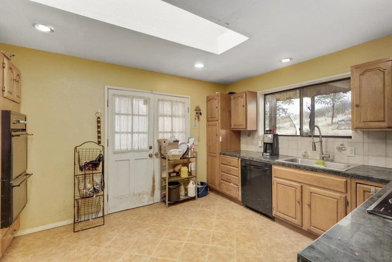 2212 Sonora Way Ramona, CA 92065 - Photo 8 of 29 a kitchen with sink cabinets and refrigerator