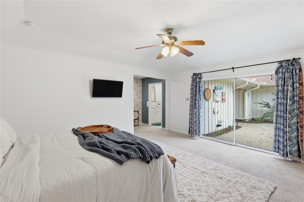 823 Ridgecrest Circle Denton, TX 76205 - Photo 18 of 40 Spacious room featuring light-toned carpeting and a ceiling fan