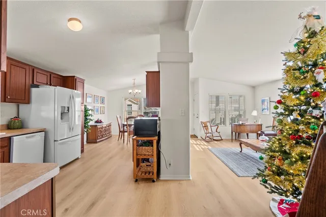 a kitchen with stainless steel appliances a stove a sink a refrigerator and cabinets