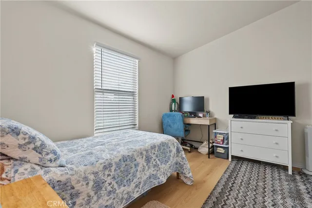 a bed room with furniture and a window