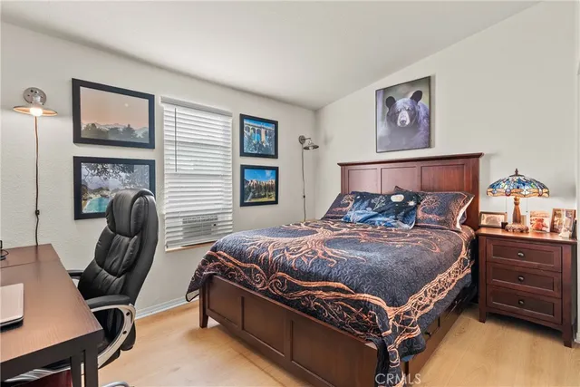 a bedroom with a bed and dresser