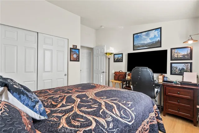 a bedroom with a bed and a chair