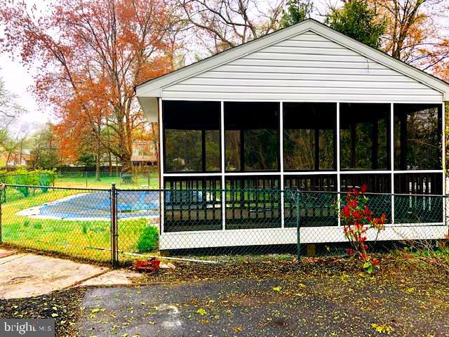 1832 Cedar Road Pasadena, MD 21122 - Photo 12 of 47 SCREEN DECK WITH ELECTRIC OFF POOL