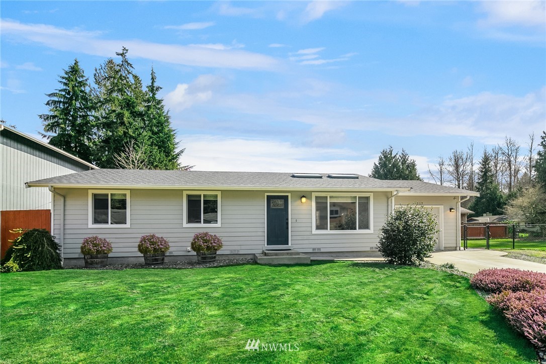 1217 102nd Drive Southeast Lake Stevens, WA 98258 - Photo 1 of 1 a front view of house with yard and green space