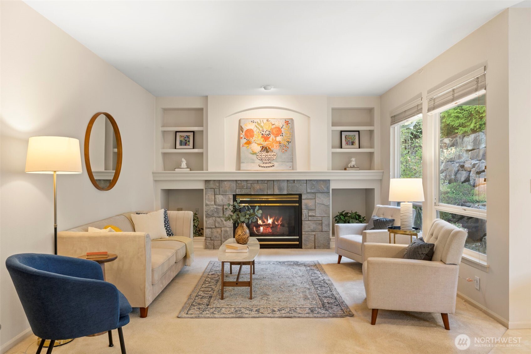 2711 204th Street Southeast Bothell, WA 98012 - Photo 12 of 22 a living room with furniture a fireplace and a large window