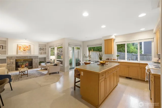a very nice looking living room with a large window and a fireplace