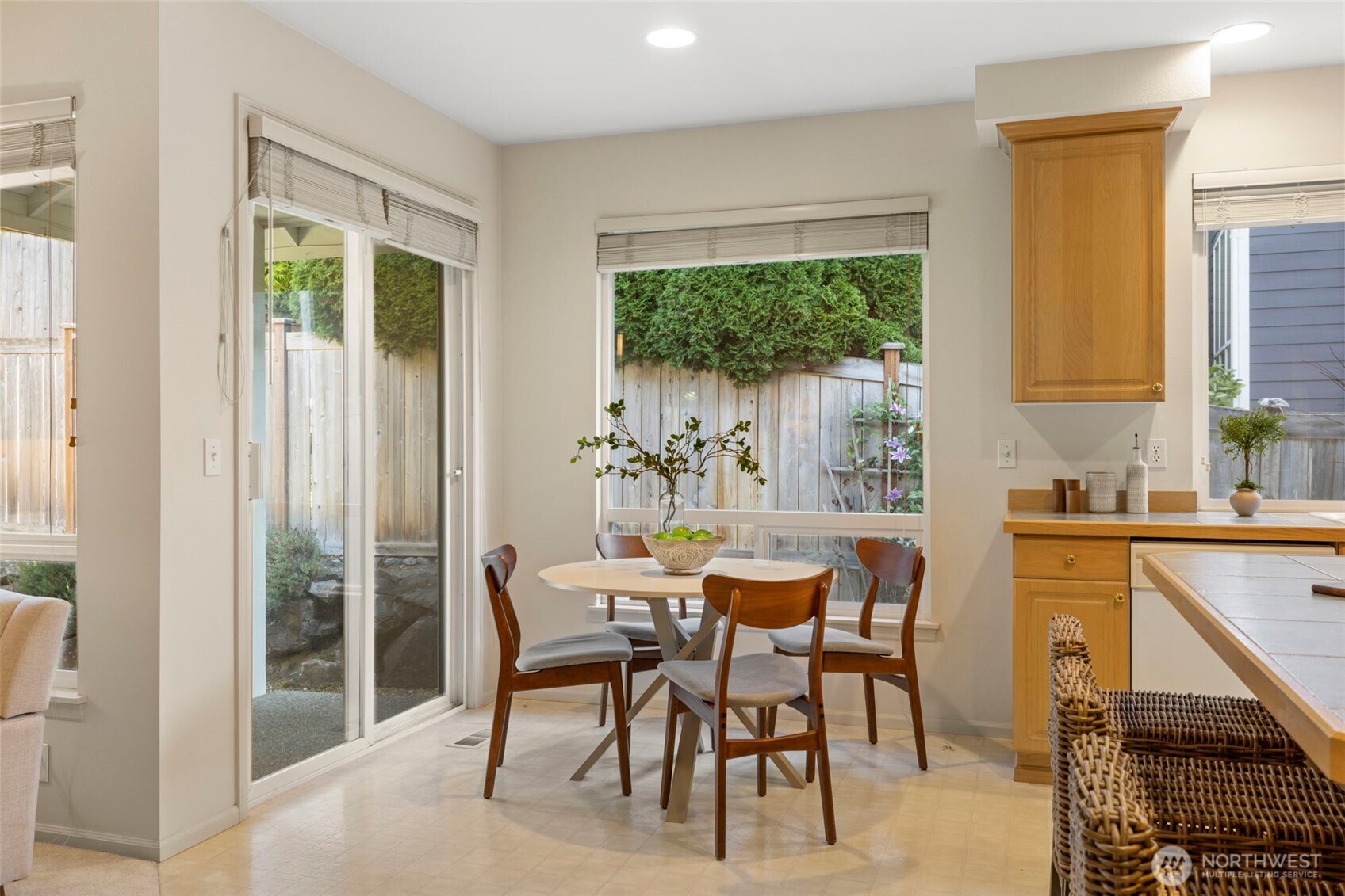 2711 204th Street Southeast Bothell, WA 98012 - Photo 10 of 22 a dining room with furniture a window and a kitchen view
