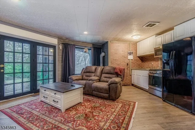 a living room with furniture and a rug