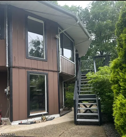 a couple of potted plants in front of a building