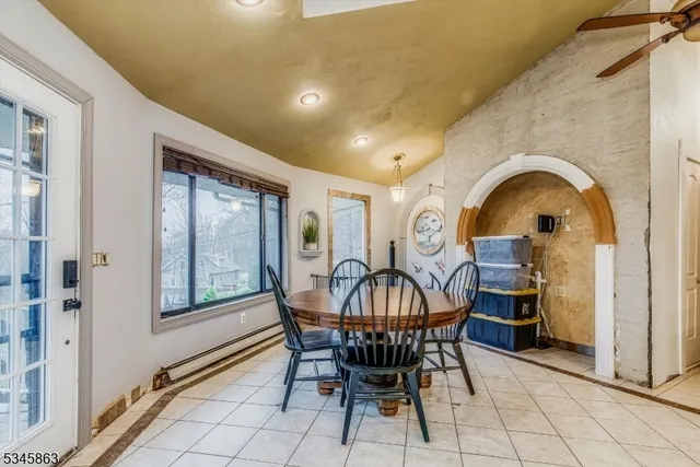 a view of a dining room with furniture window and outside view