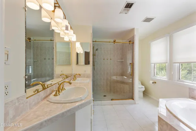 a bathroom with a sink and shower