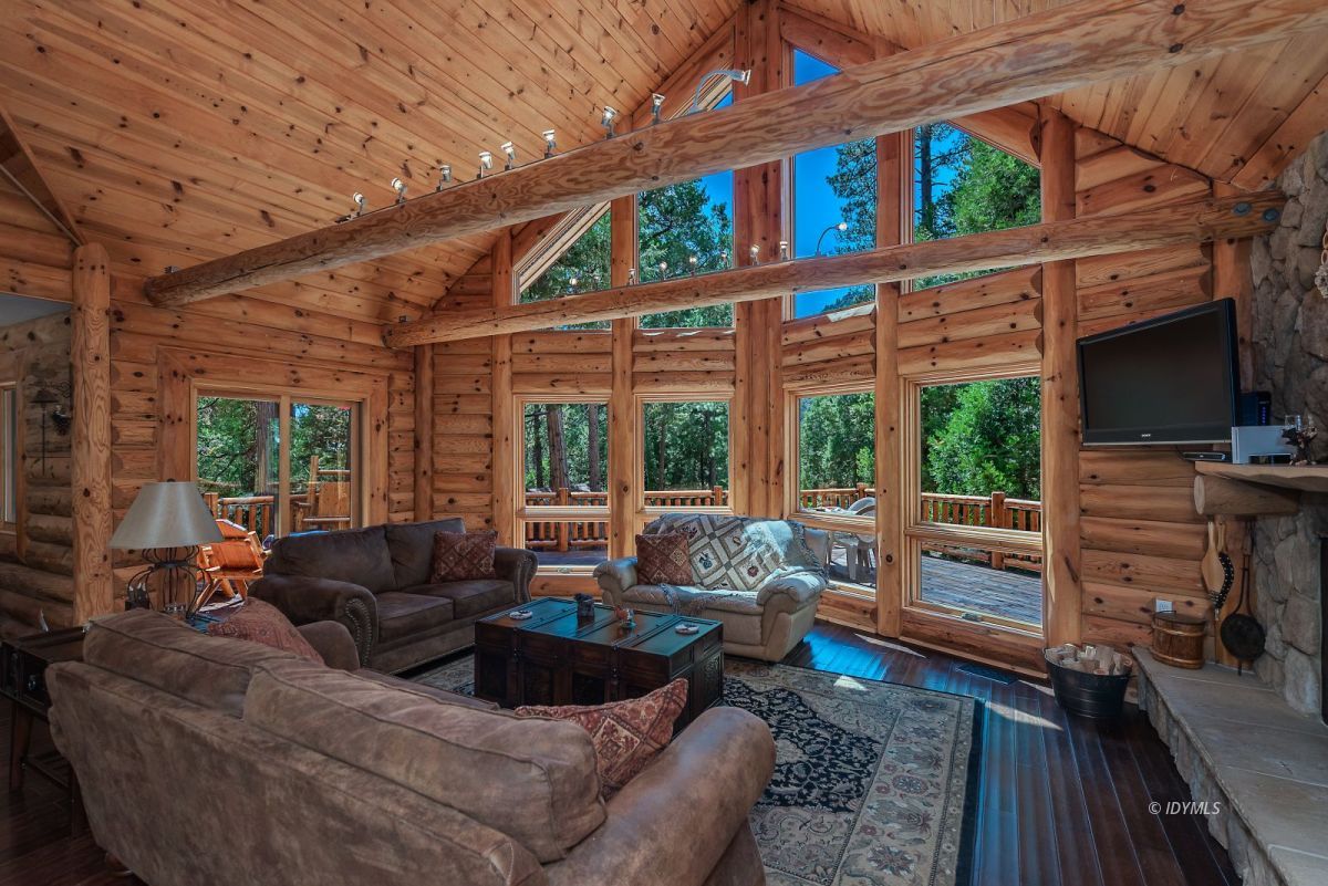 25117 Fern Valley Road Idyllwild, CA 92549 - Photo 13 of 67 a living room with furniture and a large window