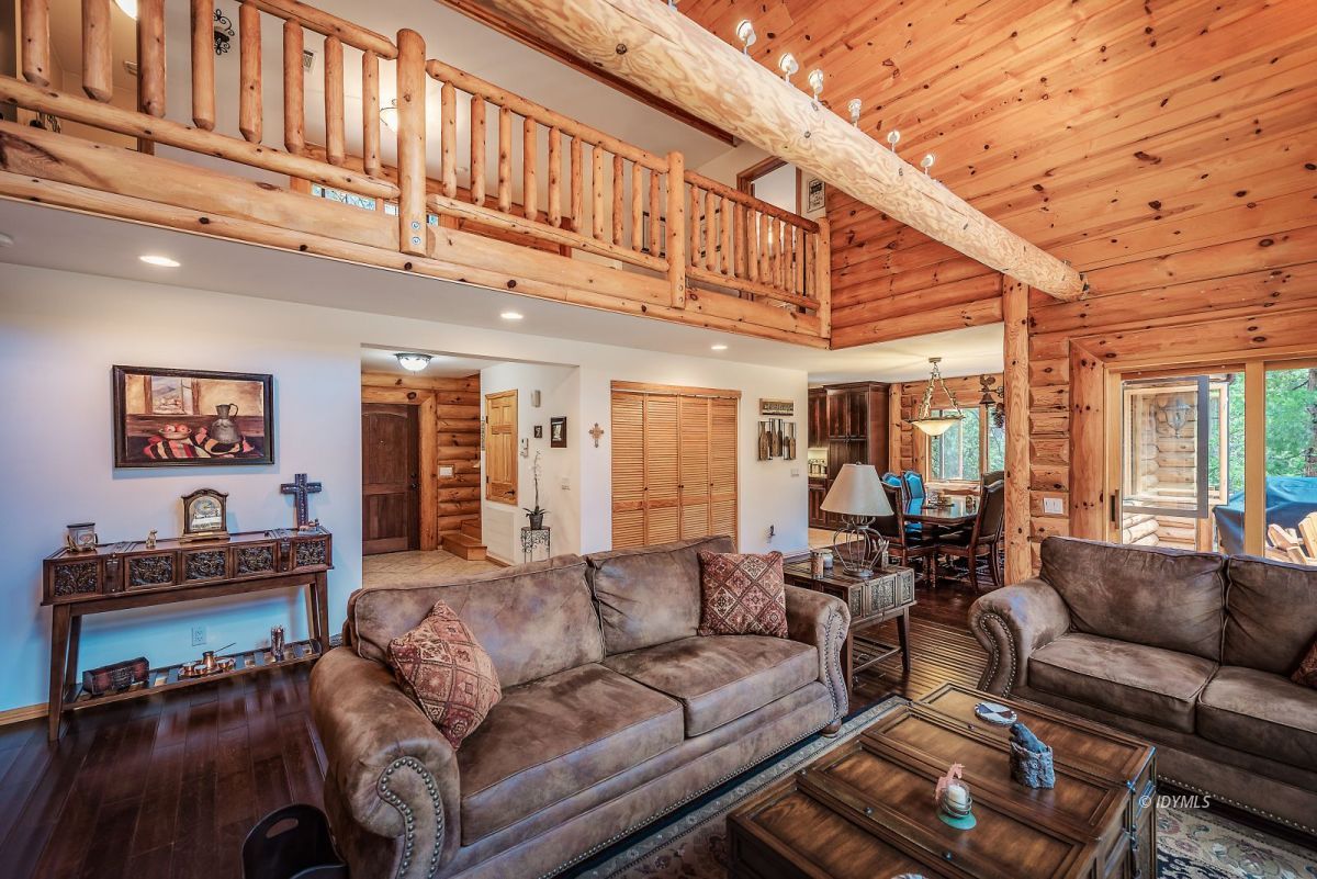 25117 Fern Valley Road Idyllwild, CA 92549 - Photo 15 of 67 a living room with furniture a ceiling fan and a window