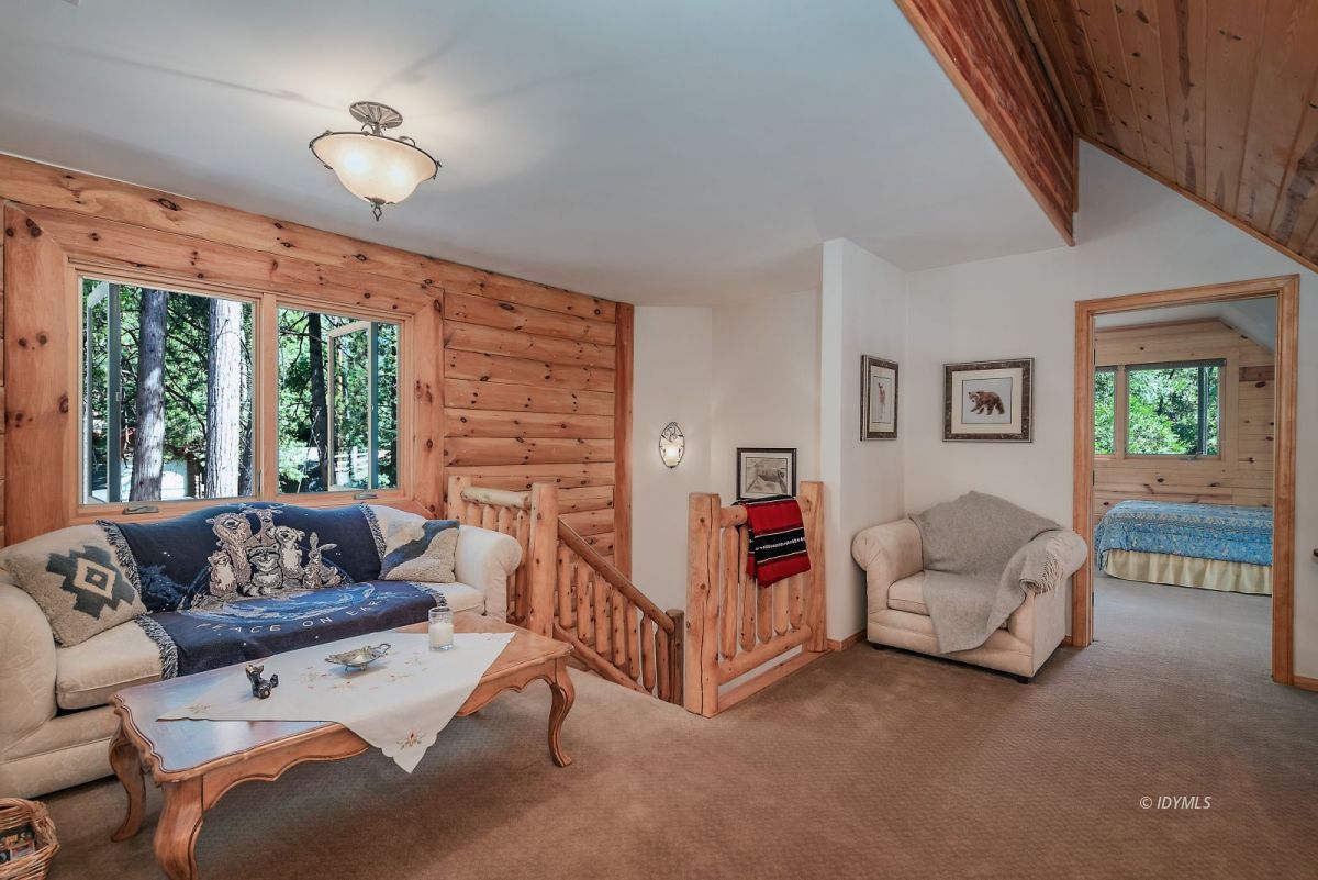 25117 Fern Valley Road Idyllwild, CA 92549 - Photo 34 of 67 a living room with furniture and a large window