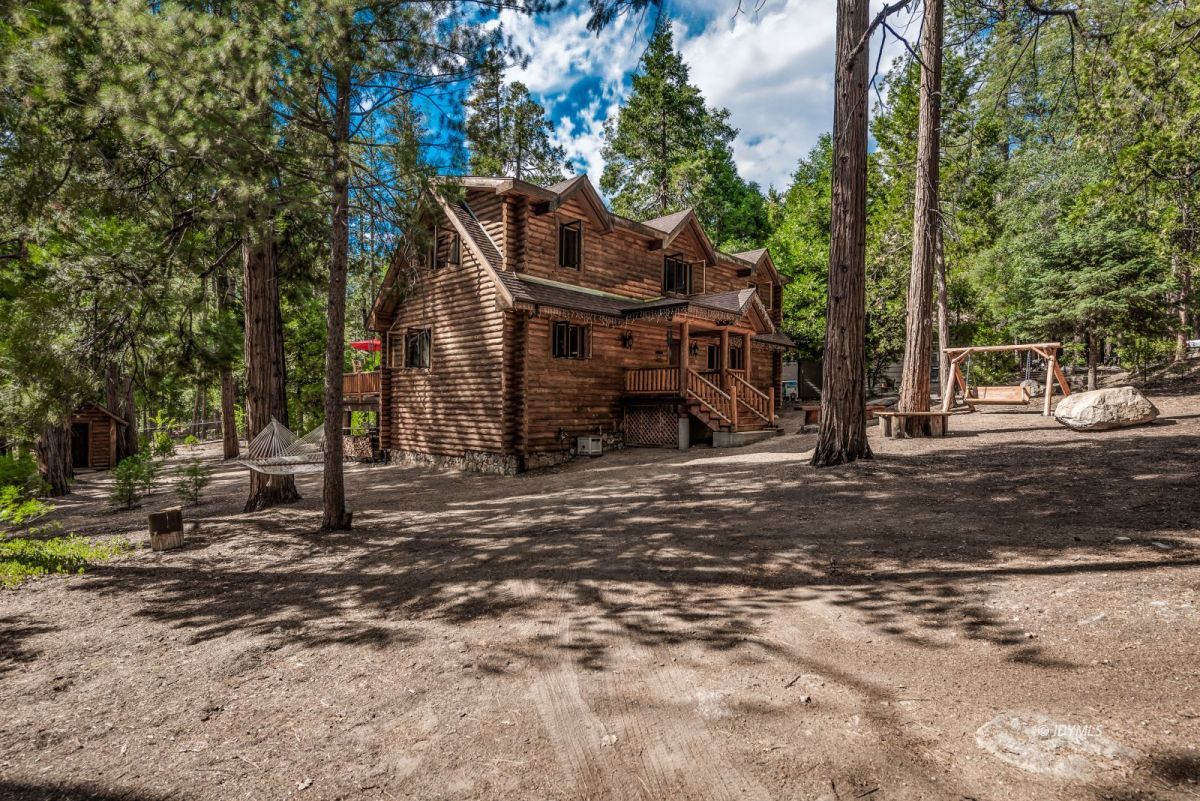 25117 Fern Valley Road Idyllwild, CA 92549 - Photo 5 of 67 a view of a large house with a tree in front