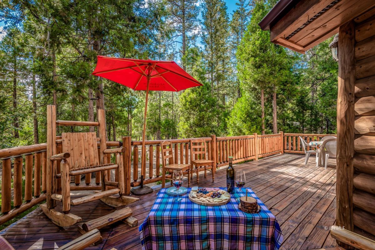 25117 Fern Valley Road Idyllwild, CA 92549 - Photo 46 of 67 a balcony view with a seating space