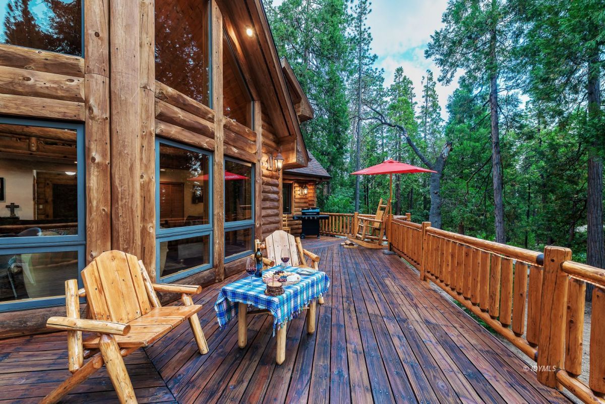 25117 Fern Valley Road Idyllwild, CA 92549 - Photo 54 of 67 a view of balcony with outdoor seating and wooden floor