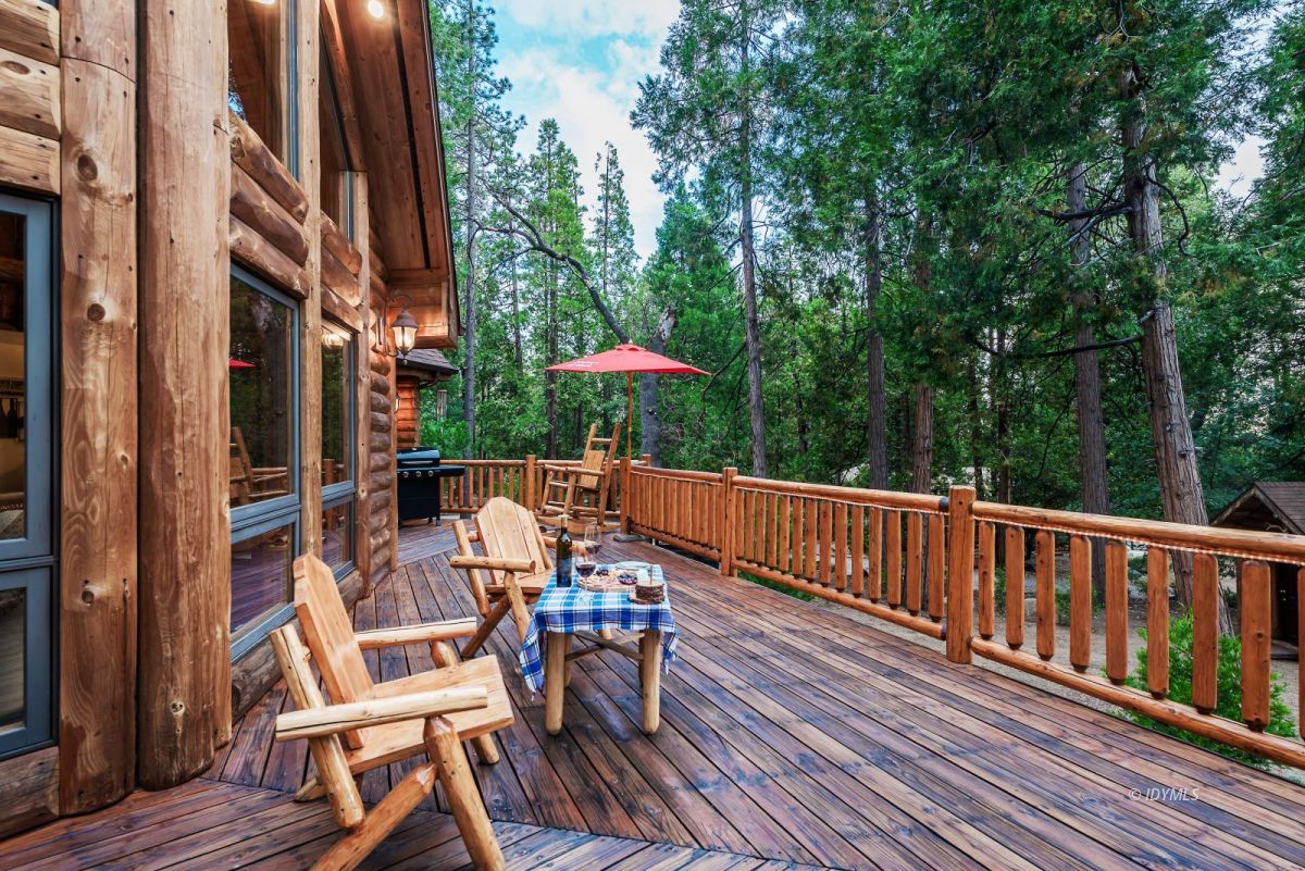 25117 Fern Valley Road Idyllwild, CA 92549 - Photo 56 of 67 a view of balcony with wooden floor and outdoor seating