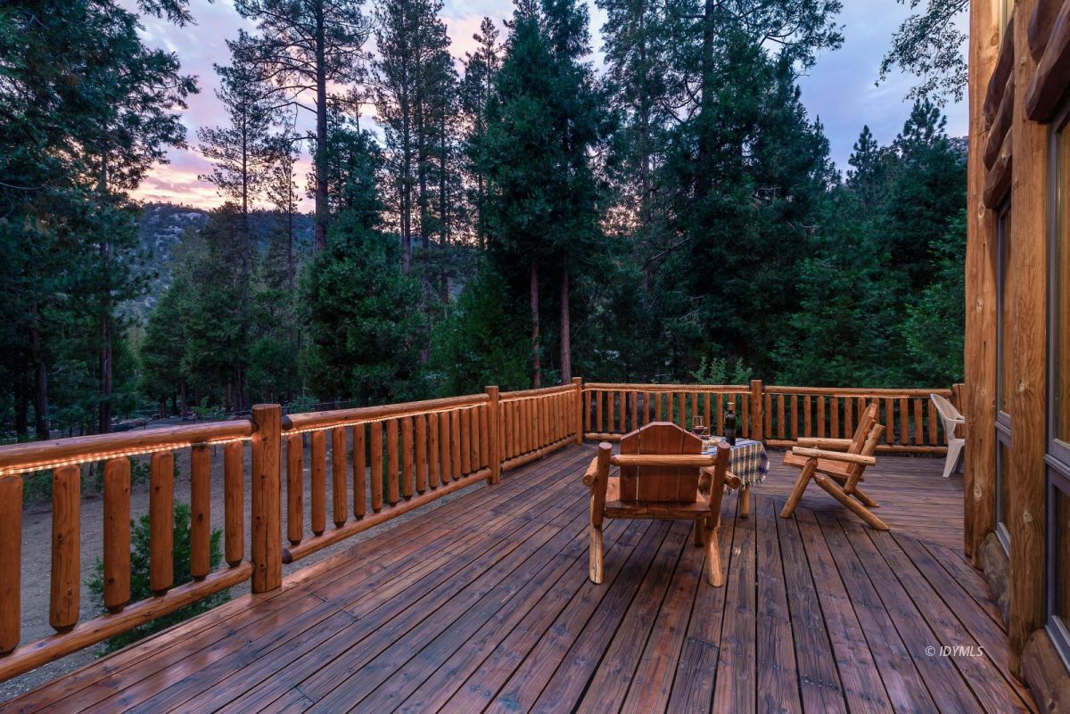 25117 Fern Valley Road Idyllwild, CA 92549 - Photo 65 of 67 a view of a wooden deck with furniture and trees