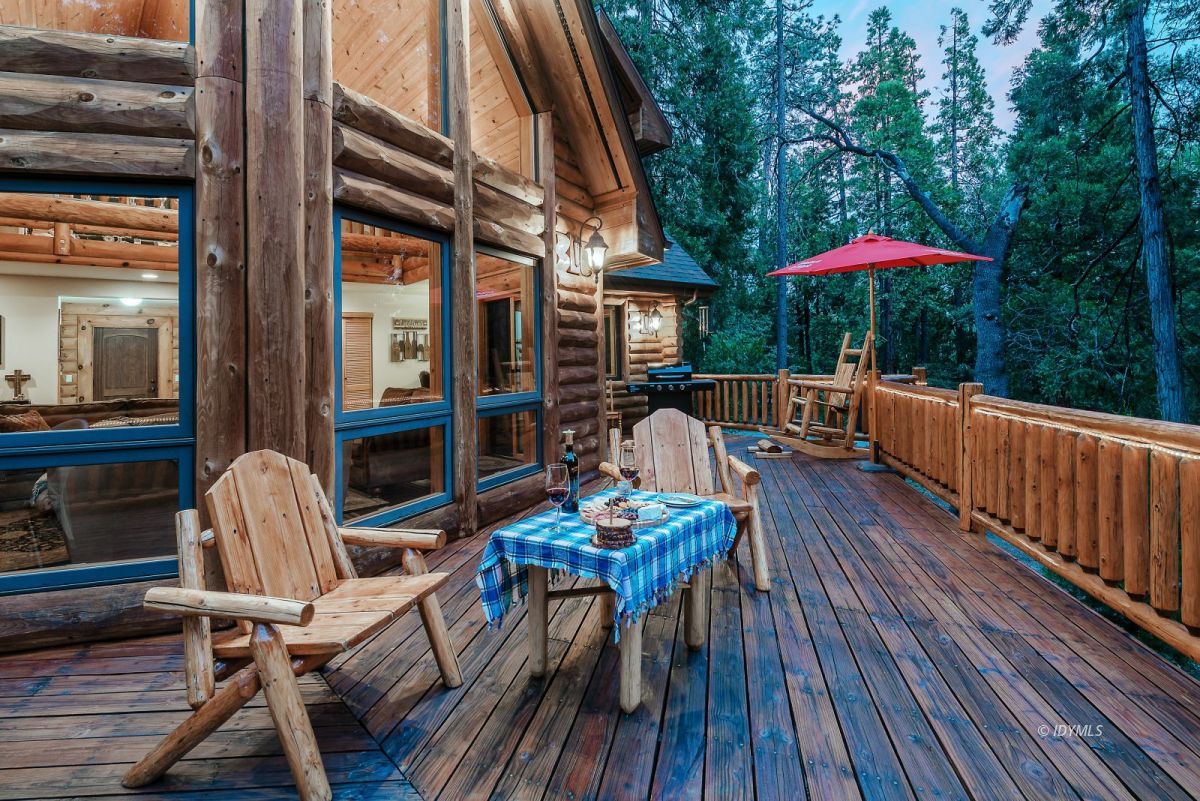 25117 Fern Valley Road Idyllwild, CA 92549 - Photo 67 of 67 a view of a patio with a table and chairs