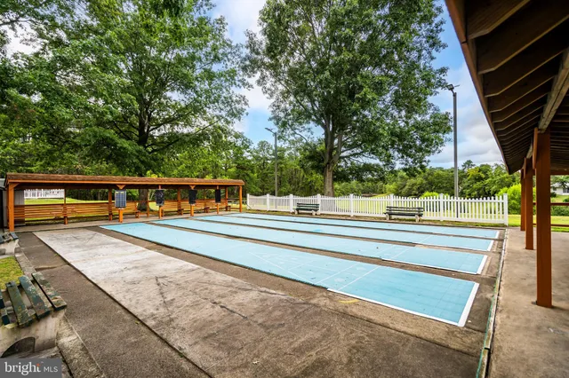 a view of a swimming pool with an outdoor seating