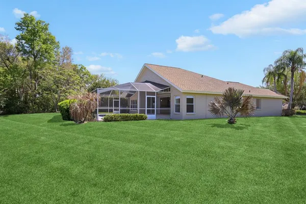 a view of a lake with a house in the background