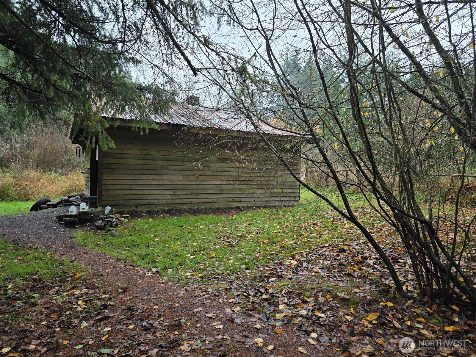 245 Cousins Road Chehalis, WA 98532 - Photo 2 of 18 a backyard of a house with lots of green space
