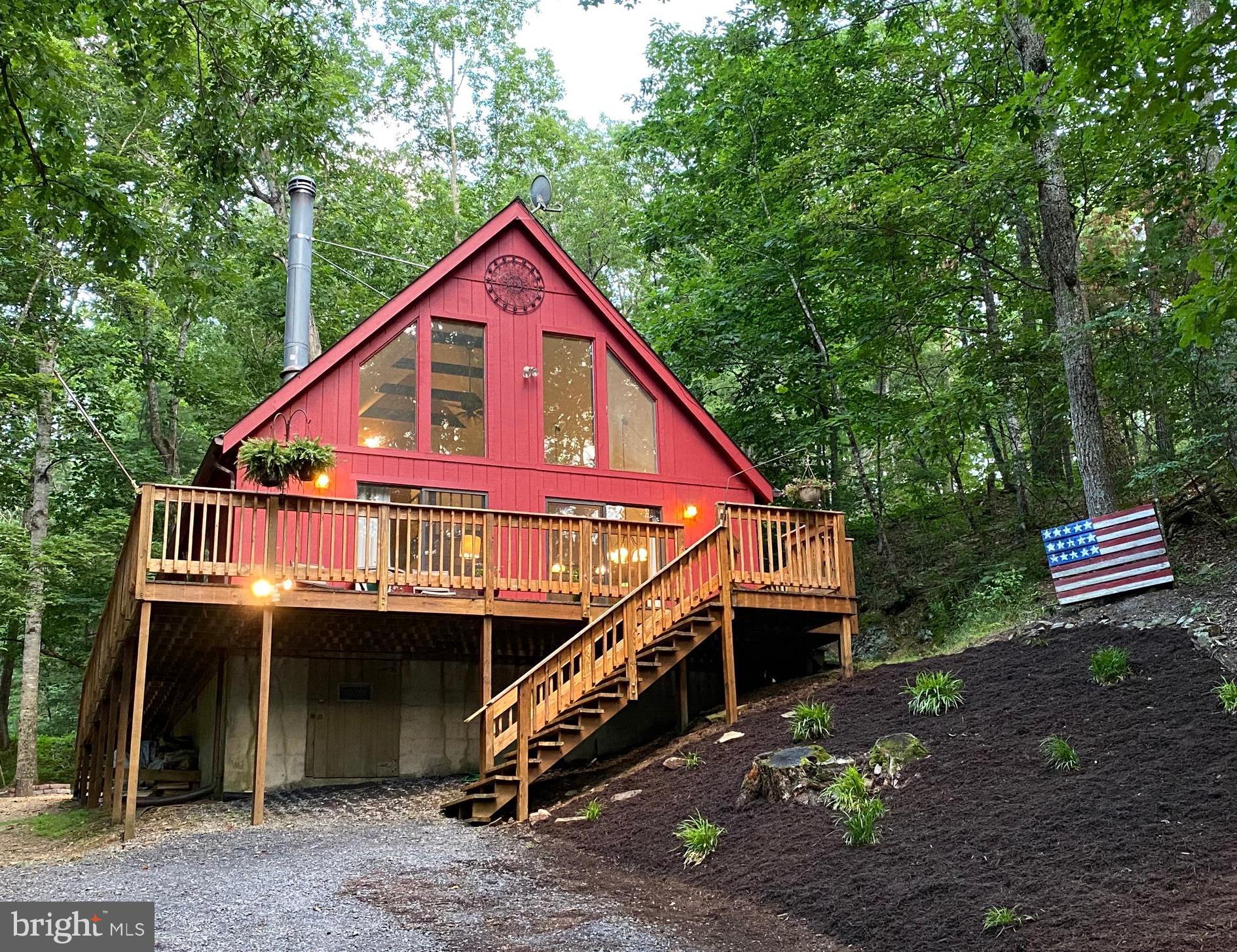 267 Susan Road Basye, VA 22842 - Photo 1 of 84 a view of house with a yard and balcony