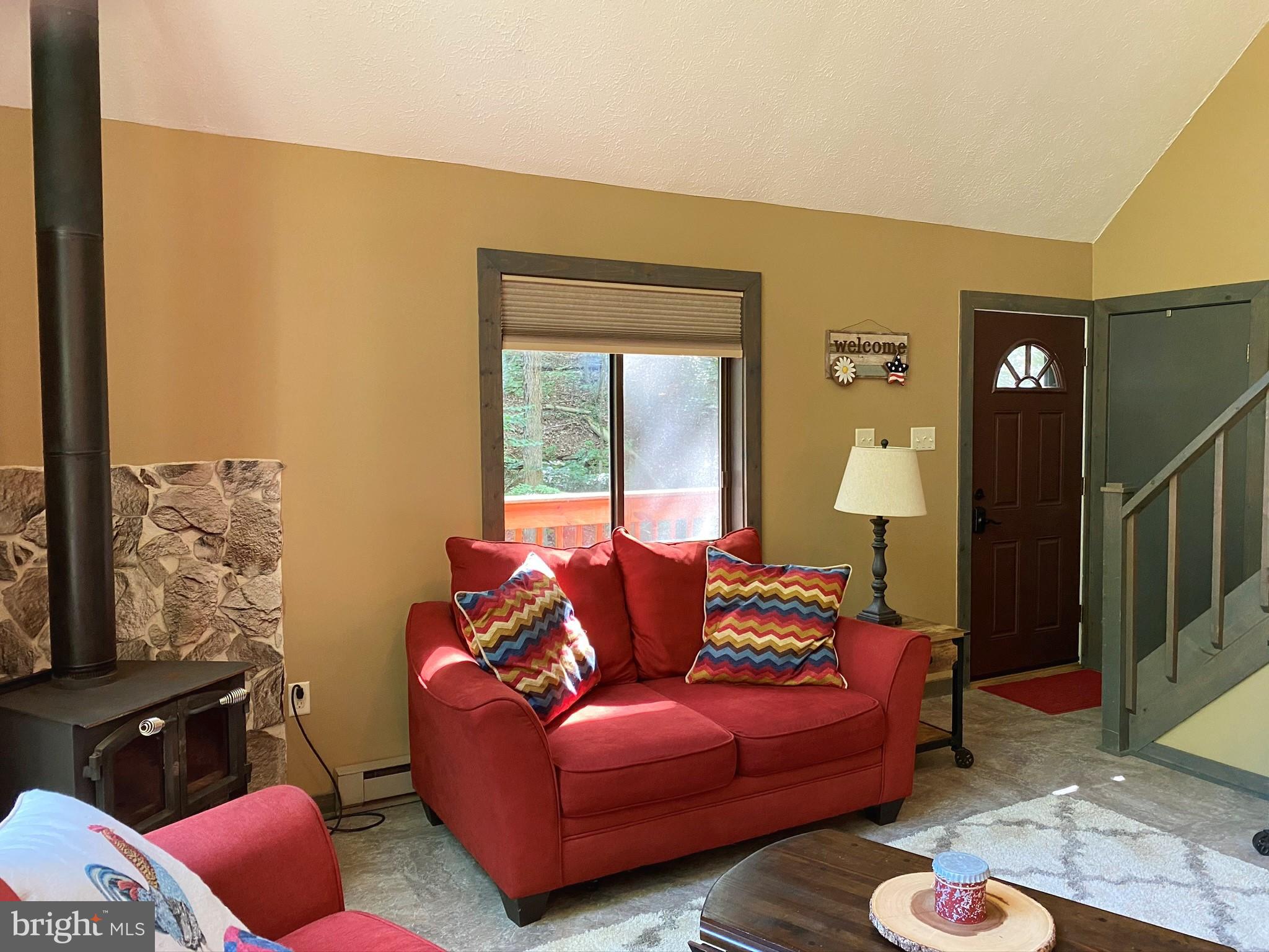 267 Susan Road Basye, VA 22842 - Photo 12 of 84 a living room with furniture and a window