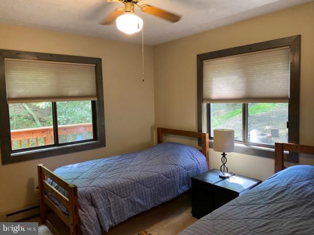 267 Susan Road Basye, VA 22842 - Photo 17 of 84 a bedroom with a large bed and a large window