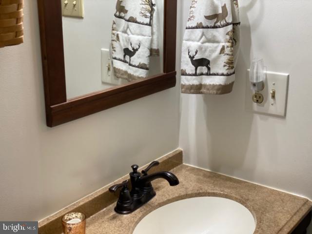 267 Susan Road Basye, VA 22842 - Photo 18 of 84 a bathroom with a granite countertop sink and mirror