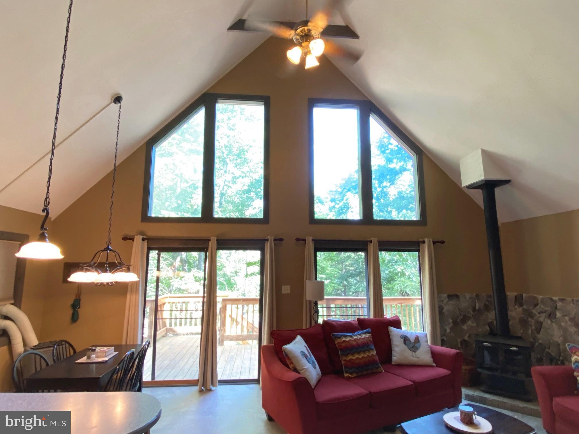 267 Susan Road Basye, VA 22842 - Photo 21 of 84 a living room with furniture and a large window