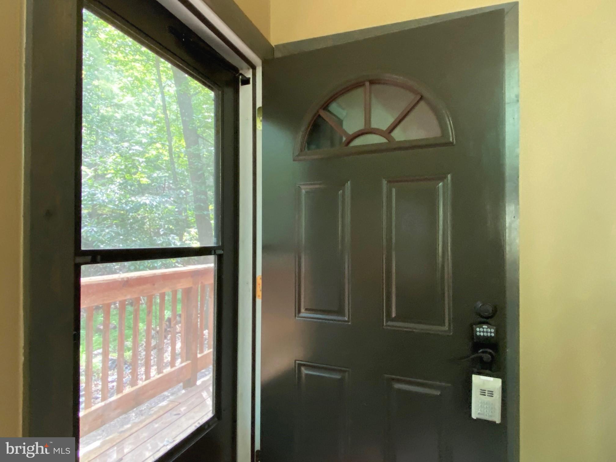 267 Susan Road Basye, VA 22842 - Photo 32 of 84 a view of a glass door and a yard