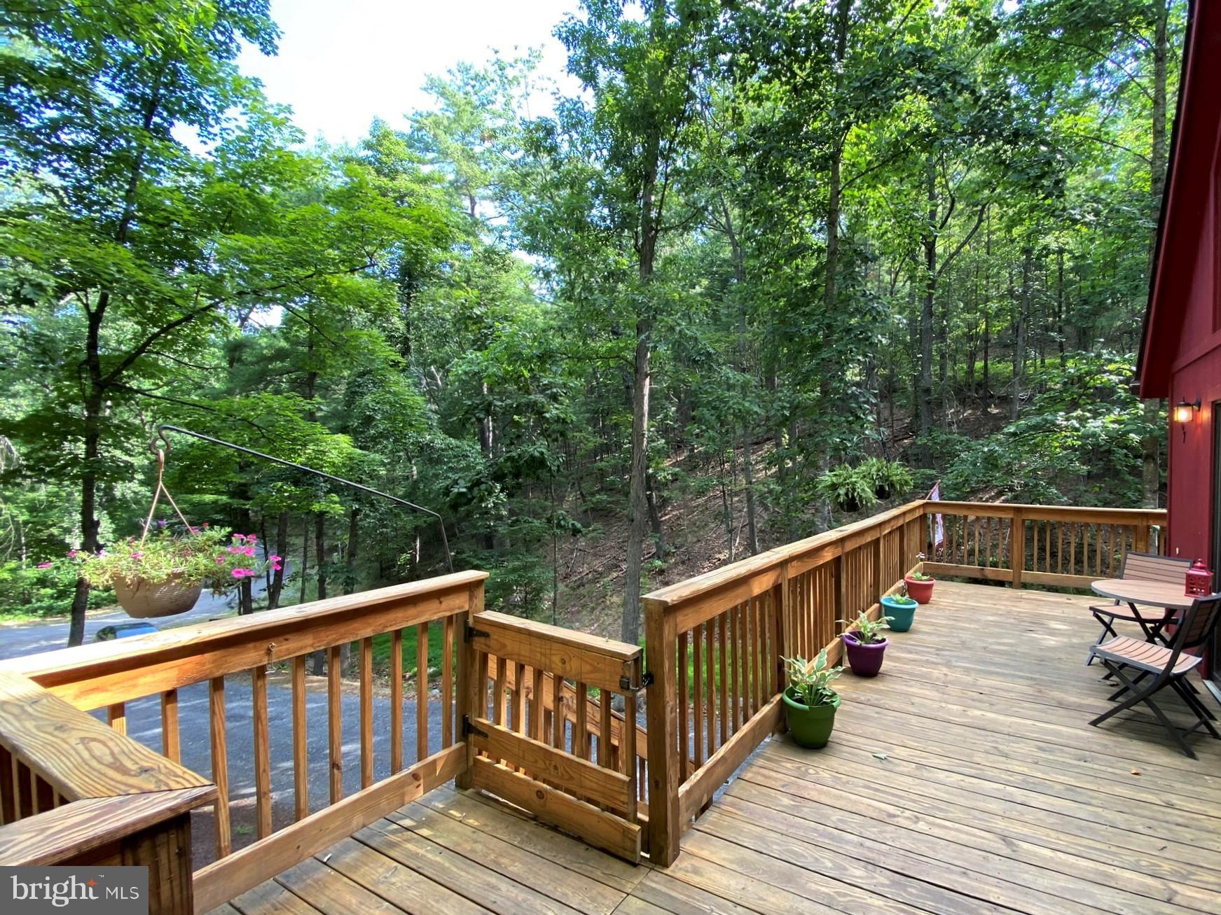 267 Susan Road Basye, VA 22842 - Photo 5 of 84 a view of balcony with wooden floor and seating space