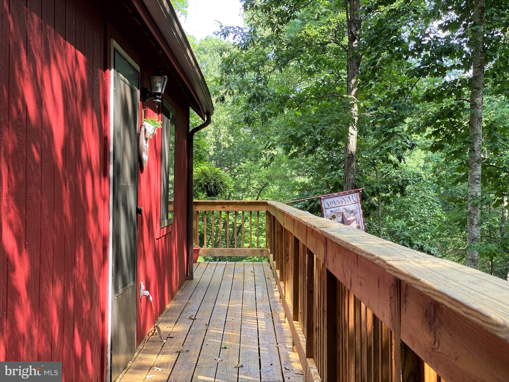 267 Susan Road Basye, VA 22842 - Photo 6 of 84 a balcony with wooden floor and outdoor space