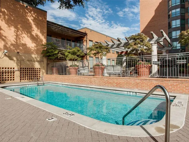 a view of a swimming pool with a patio
