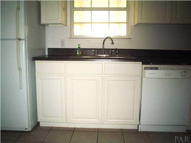 4521 Creighton Road Pensacola, FL 32504 - Photo 8 of 24 Kitchen has a dishwasher and a window that overlooks the florida room.