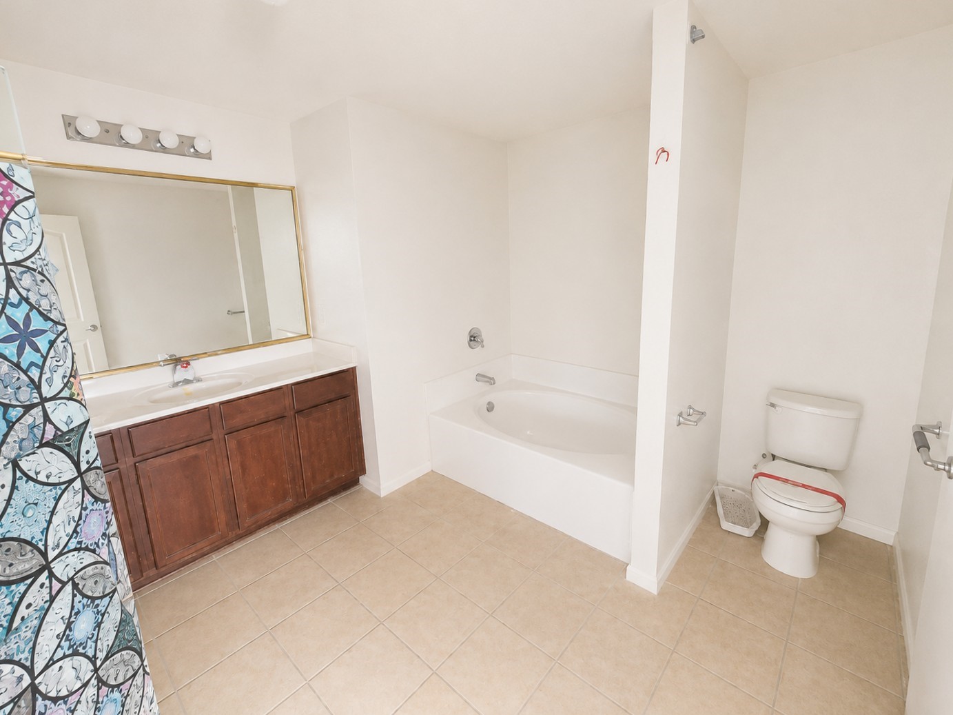 341 Comanche Plains Road La Marque, TX 77568 - Photo 10 of 17 a bathroom with a bathtub sink mirror and toilet