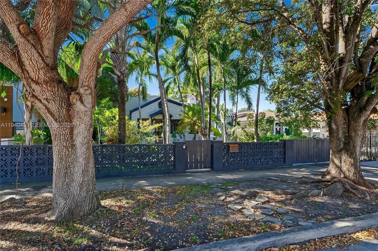 452 Southwest 21st Road Miami, FL 33129 - Photo 45 of 51 a view of a yard with plants and trees