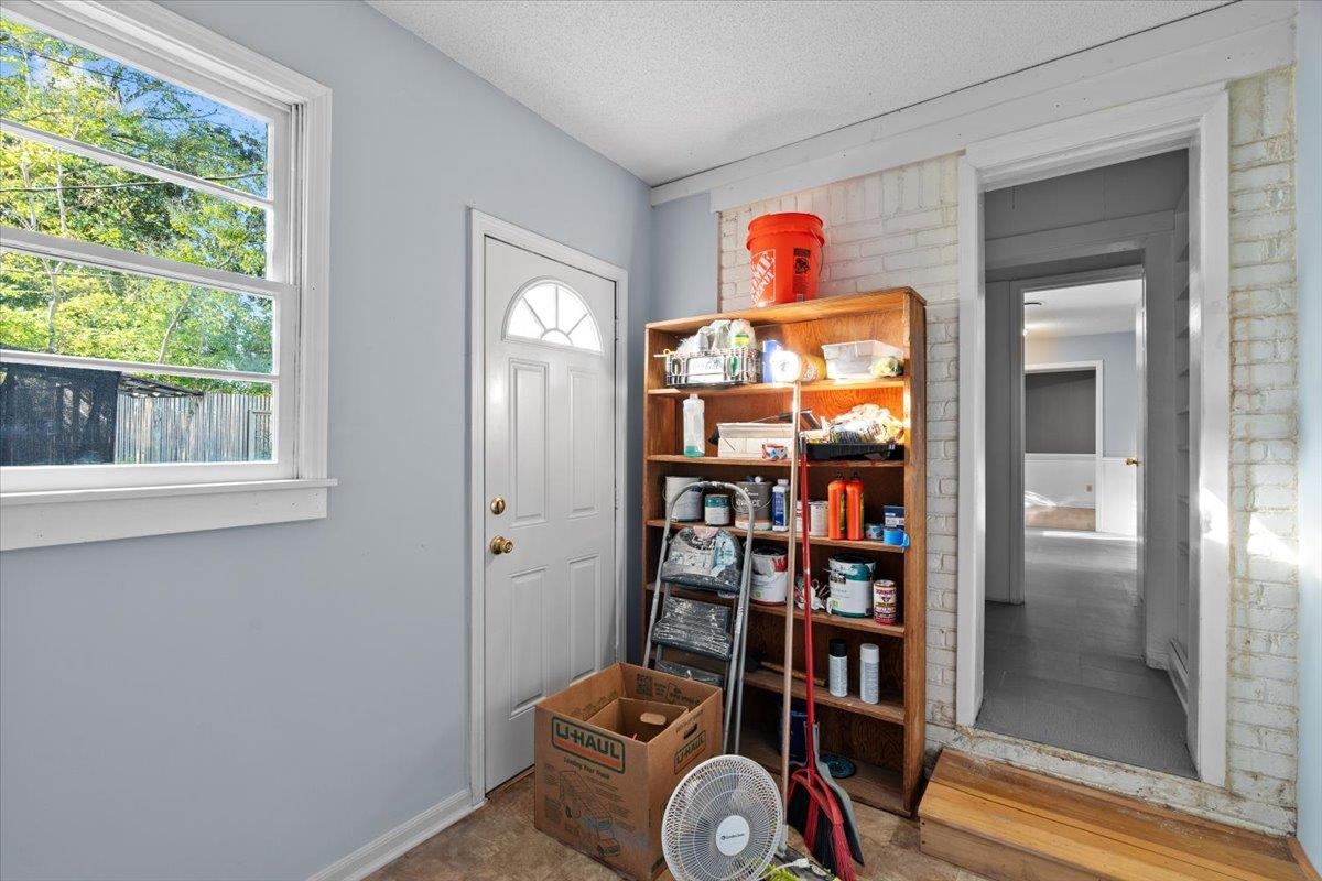 1495 Whitewater Road Memphis, TN 38117 - Photo 11 of 27 a room with bookshelf and a window