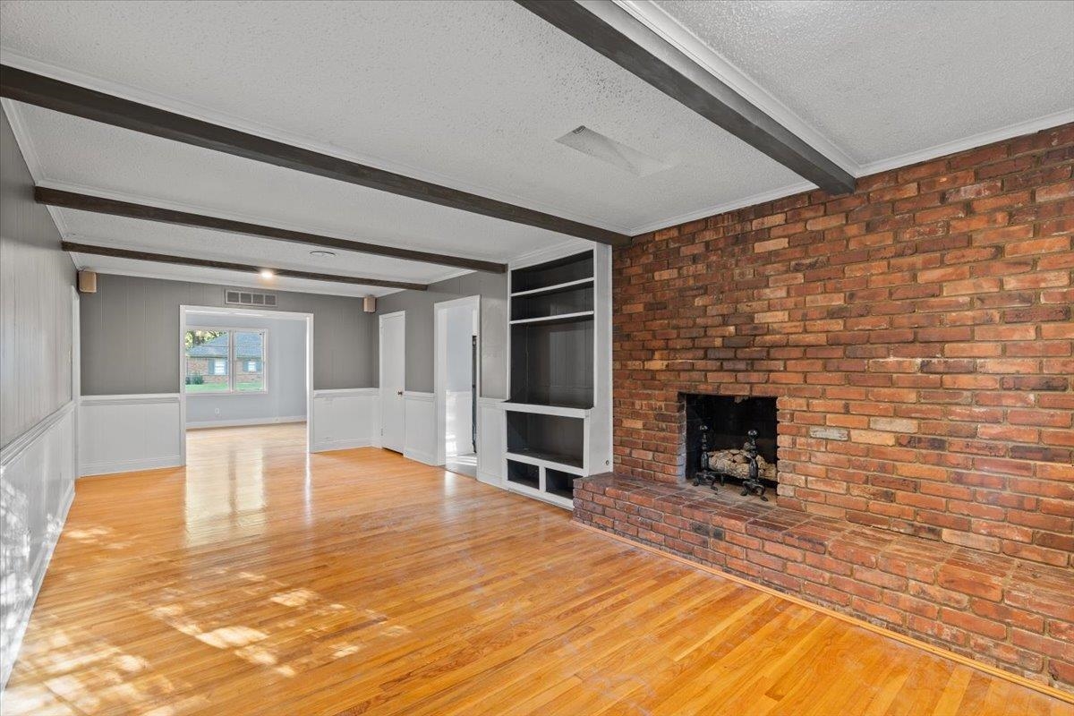 1495 Whitewater Road Memphis, TN 38117 - Photo 13 of 27 a view of an empty room with a fireplace and a window
